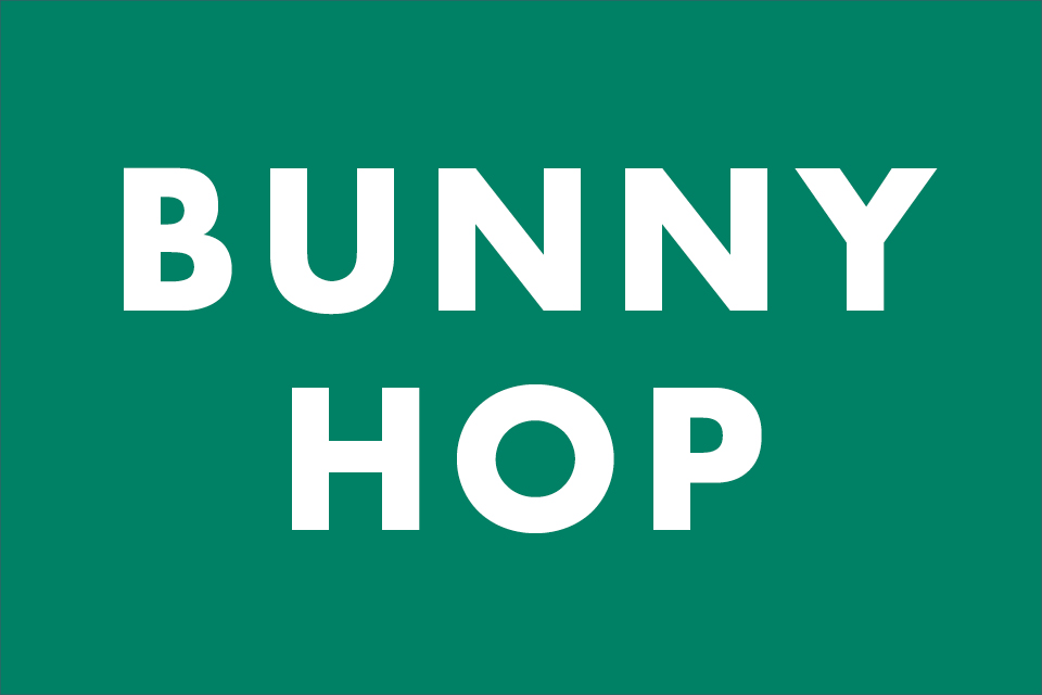 White words that read Bunny Hop on dark green background