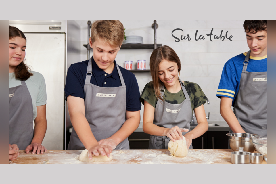 four kids cooking at a counter
